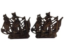 A pair of metal ship bookends.