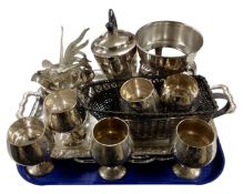 A tray containing plated wares including serving trays, a three piece tea service, goblets,