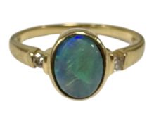 An 18ct gold opal and diamond ring, size N. CONDITION REPORT: 3.