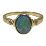 An 18ct gold opal and diamond ring, size N. CONDITION REPORT: 3.