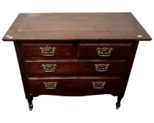 An Edwardian mahogany two-over-two four drawer chest.