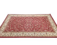 A machined Persian design carpet on red ground, 160cm by 230cm.