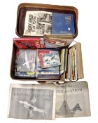 A luggage case containing mid-20th century books and magazines relating to aircraft.