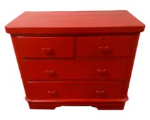 A red-painted two-over-two four drawer chest.