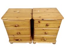 A pair of pine three drawer bedside chests