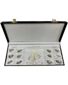 Twelve silver rings in fitted case.
