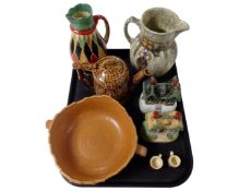A tray containing antique and later ceramics including Staffordshire cottage ornaments,