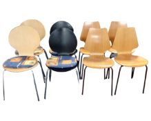 A set of four plywood chairs together with two further pairs of plywood chairs on metal legs.
