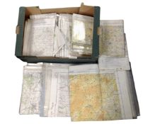 A box containing a large quantity of folded maps supplied by the Ministry of Defence in plastic