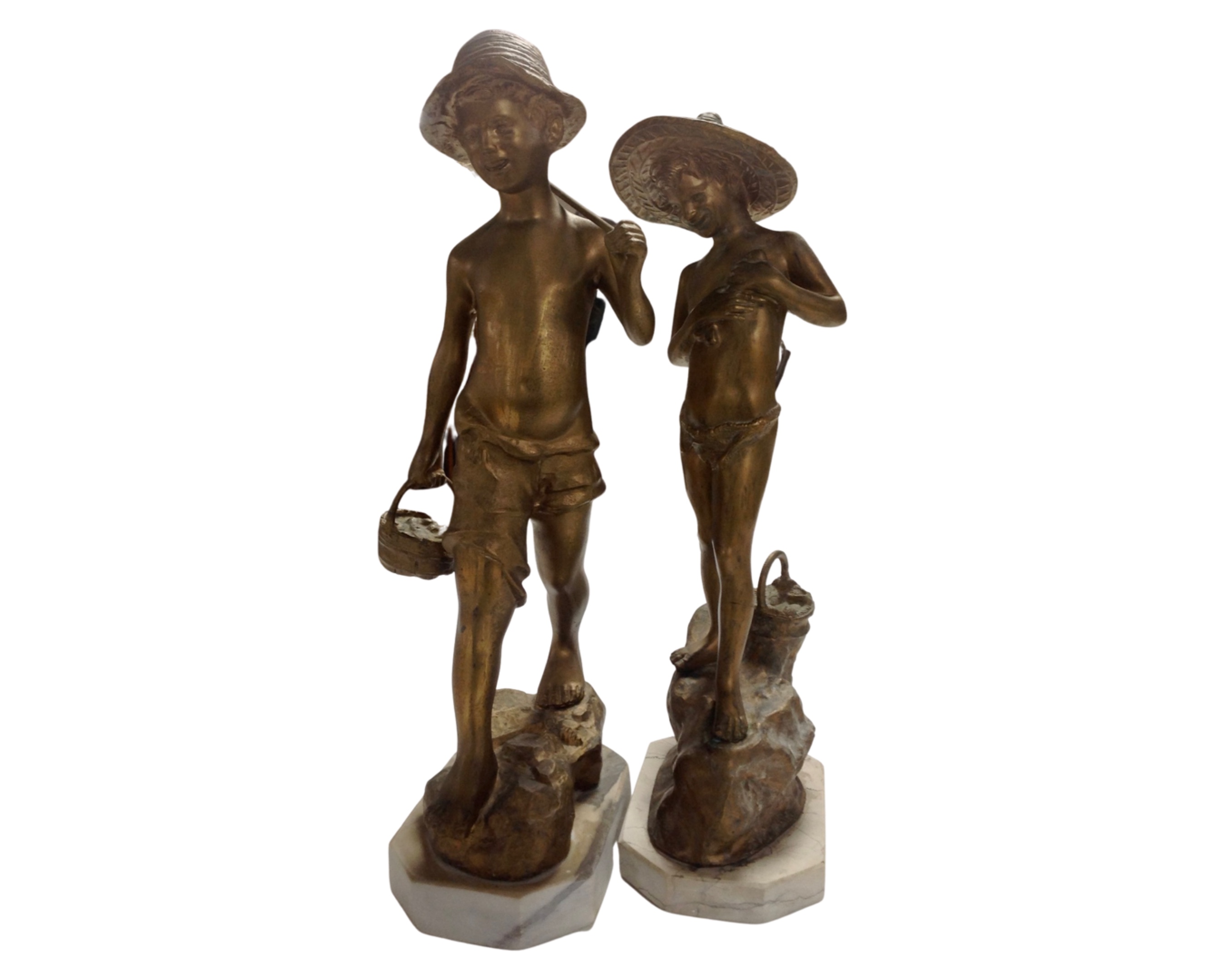 A pair of gilded spelter figure fisher boys on marble bases.