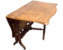 A 19th century walnut Sutherland table on bobbin legs.