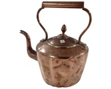 A Victorian copper kettle.
