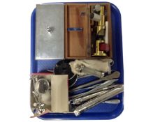 A tray containing a collection of vintage medical instruments together with a brass Student