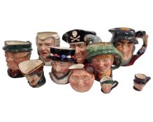 A collection of 10 assorted small and miniature character jugs including Beefeater,