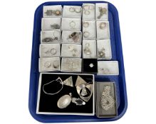 A good assortment of silver jewellery including dress rings, lockets, pendants,