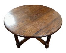 An oak circular coffee table.
