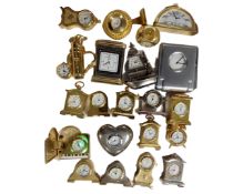 A collection of 21 assorted miniature desk clocks.