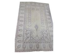 An Indian rug on cream ground, 122cm by 188cm.