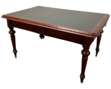 A Victorian mahogany library table with leather inset panel and fitted drawer.