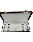 Twelve silver rings in fitted case