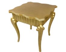 A shaped contemporary gilt occasional table.