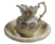 A floral patterned ceramic wash jug and bowl.