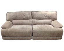 An oversized two seater manual reclining settee upholstered in a stitched fabric.