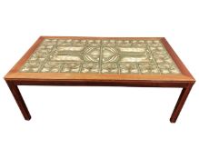 A Scandinavian rosewood veneered tile topped rectangular coffee table.