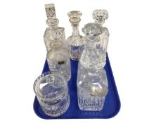 A tray containing six Continental crystal decanters together with a further cut glass lidded pot.