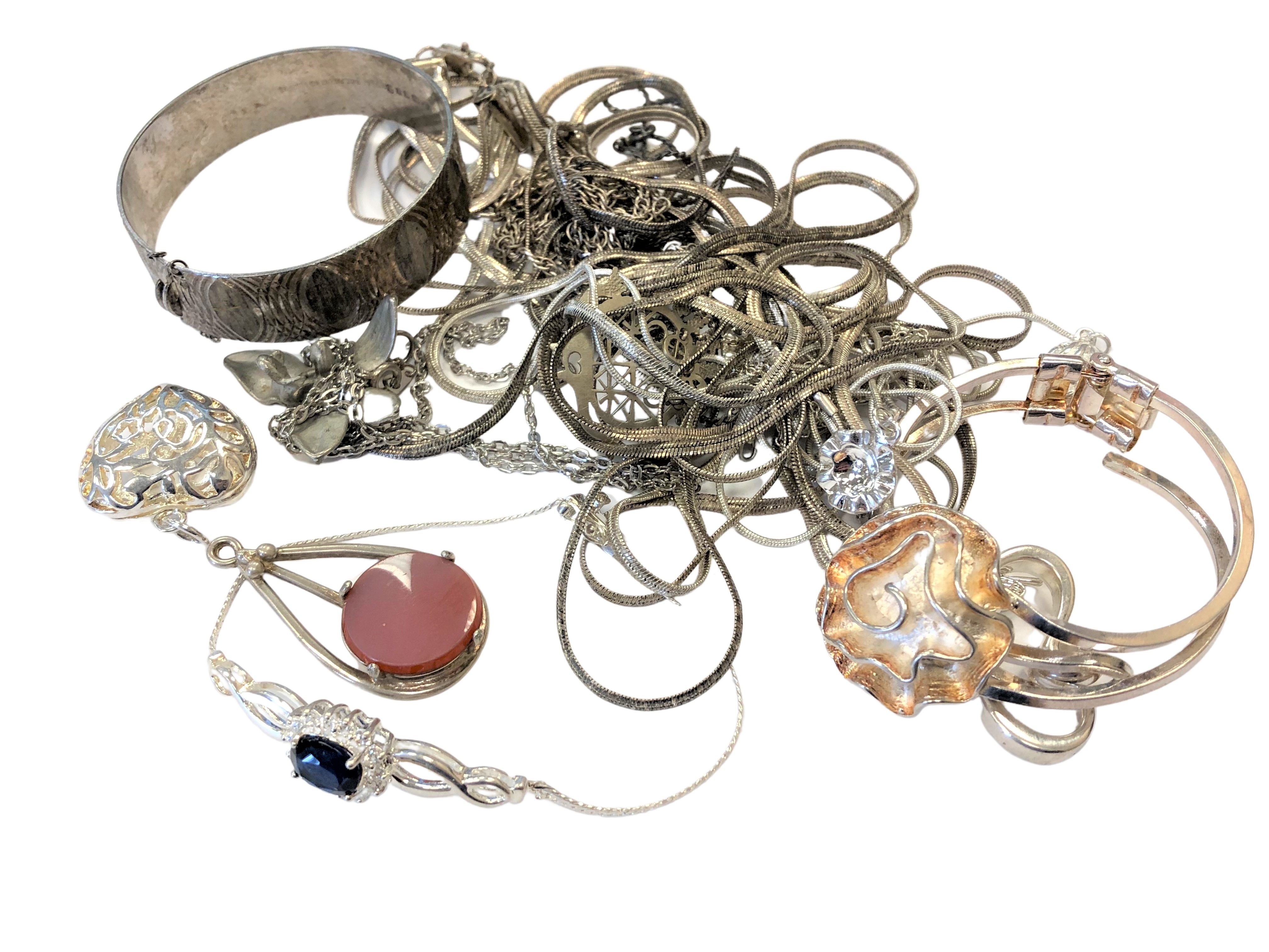 A collection of silver and white metal jewellery