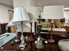 A contemporary table lamp with a leaded glass shade together with four further table lamps,