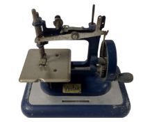 A mid-20th century Vulcan toy sewing machine.