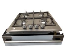 An AEG stainless steel food warming drawer together with a stainless steel gas four burner hob.