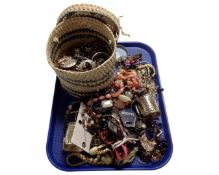 A tray containing a wicker basket and a large quantity of assorted costume jewellery.