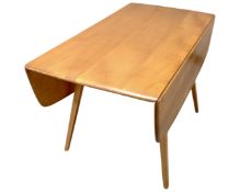 An Ercol elm and beech drop leaf table.