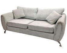 A contemporary two seater settee on chrome legs.