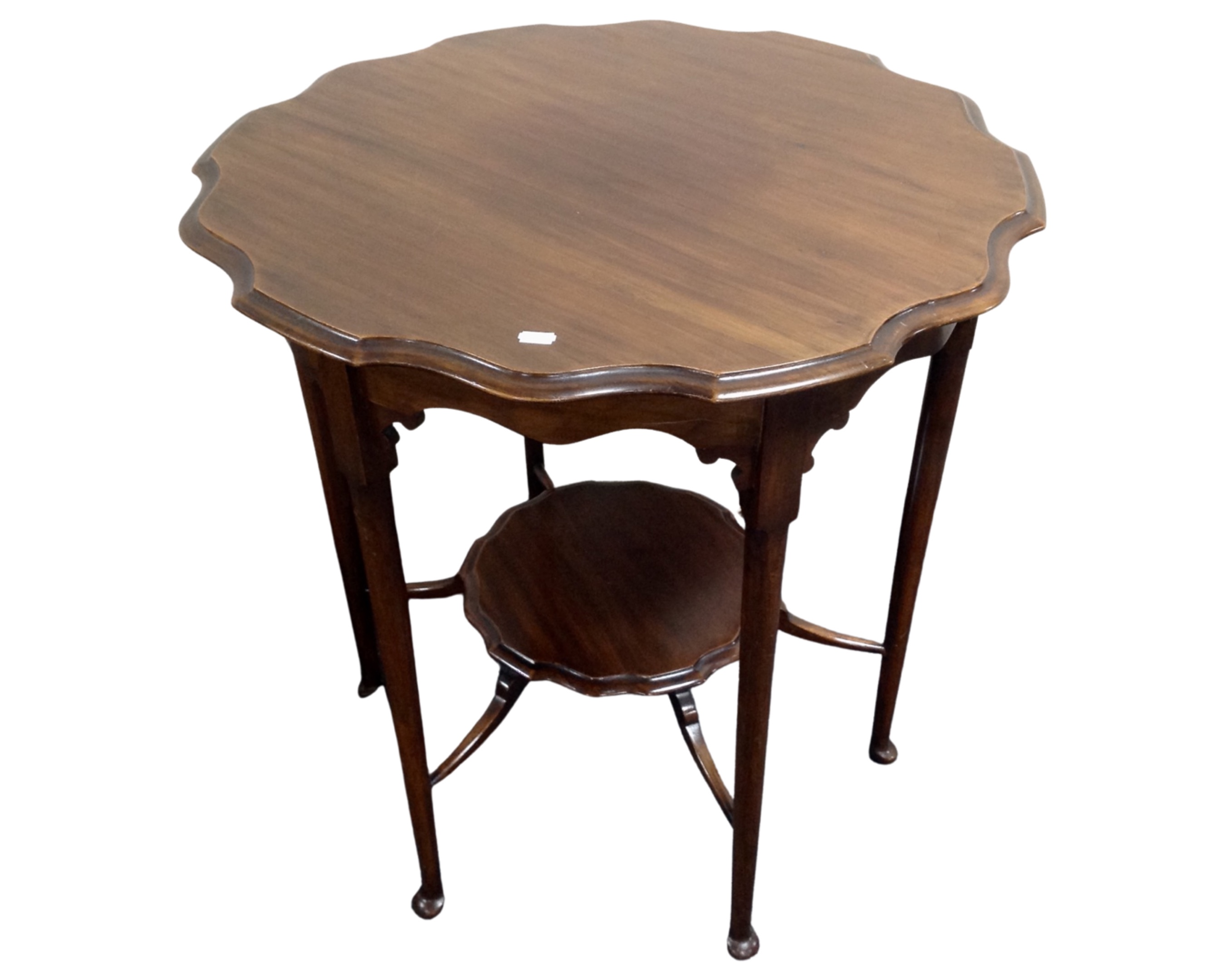 An Edwardian mahogany shaped occasional table.