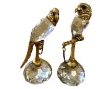 A pair of crystal and gilt metal parrot figures with blue glass eyes, height 12.5 cm.