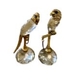 A pair of crystal and gilt metal parrot figures with blue glass eyes, height 12.5 cm.