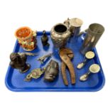 A tray of collectables including carved nut crackers, silver plated items, biblical scene vase,