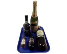 A tray containing five bottles of alcohol including Charles Heidsieck champagne, port, wine,