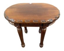 An Indonesian hardwood oval carved occasional table.