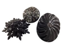 Three Whitby Jet brooches.