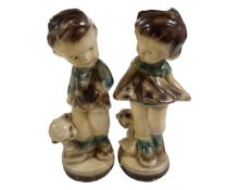 A pair of 20th century chalk figures of a boy and girl.