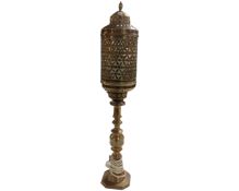 A Middle Eastern brass table lamp.