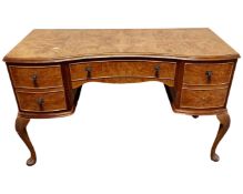 A Queen Anne style burr walnut veneered dressing table.