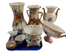 A tray containing assorted ceramics including an Italian flower encrusted planter and lidded