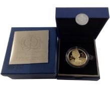 A Royal Mint Queen Elizabeth II Diamond Jubilee gold plated £5 coin with a mintage of 12500.