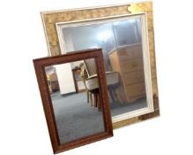 Two framed mirrors.