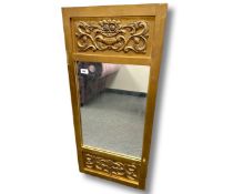 An antique gilded mirror, 43cm by 95cm.